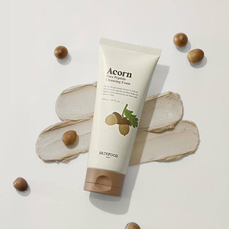 ProtoClinical k-beauty SKINFOOD Acorn Pore Peptide Cleansing Foam 150ml single beige cleanser tube standing upright on a clean white background