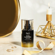 ProtoClinical k-beauty Dr.G Royal Black Snail Ampoule 30ml shown as a dark olive product silhouette with a soft beige top between warm brown side tones.
