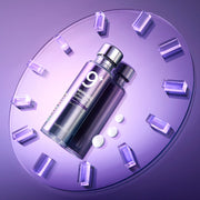 ProtoClinical k-beauty numbuzin No.9 NMN BIO Lifting-Sil Essence 50ml single upright silver-lilac essence bottle centered above a dark purple base on a lavender background.