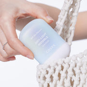 ProtoClinical k-beauty warm peach and gray beauty graphic with soft vertical blocks on a light background.