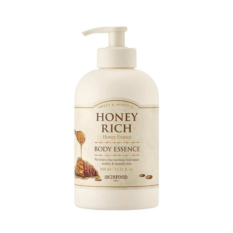 ProtoClinical k-beauty SKINFOOD Honey Rich Body Essence 450ml shown as a tall blush-beige package centered upright with pale blue side shading on a white background
