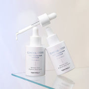 ProtoClinical k-beauty beige beauty bottle silhouette with pale blue side accents on a light background.