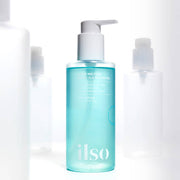 ProtoClinical k-beauty blue-gray beauty product silhouette with soft pink side accents on a pale background.