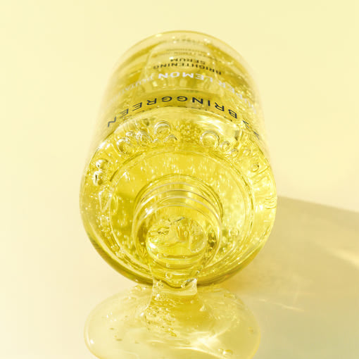 ProtoClinical k-beauty warm yellow beauty product silhouette centered on a light background with soft beige shading.