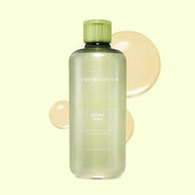 ProtoClinical k-beauty pale yellow beauty product silhouette centered on a light background with soft olive shading.
