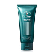 ProtoClinical k-beauty Dr.Groot Density Care Treatment Basil & Neroli 300ml shown as a dark teal bottle silhouette centered on a white background with soft peach side accents.