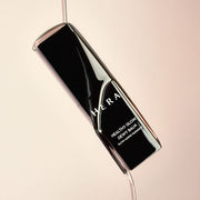 ProtoClinical k-beauty HERA HEALTHY GLOW DEWY BALM 10g dark diagonal balm silhouette on a warm beige background.