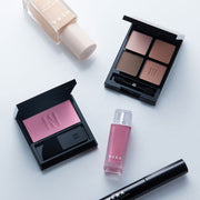 ProtoClinical k-beauty two dark blue beauty bottle silhouettes on a muted lavender background.