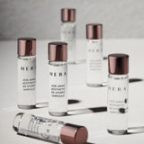 ProtoClinical k-beauty HERA AGE AWAY AESTETIC BX HYDRO AMPOULE 5ml X 12ea abstract product graphic with soft gray vertical silhouettes in a three-item set on a light background