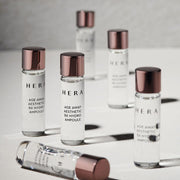 ProtoClinical k-beauty HERA AGE AWAY AESTETIC BX HYDRO AMPOULE 5ml X 12ea abstract product graphic with soft gray vertical silhouettes in a three-item set on a light background