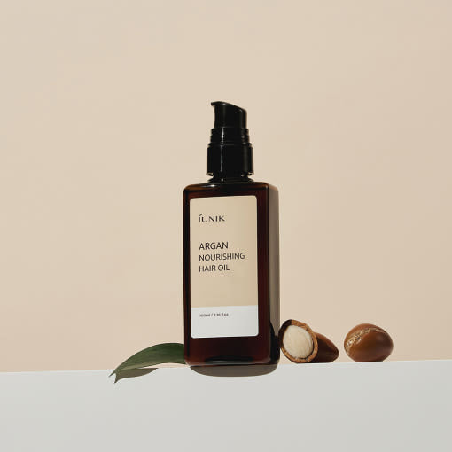 ProtoClinical k-beauty warm beige beauty product silhouette with a soft brown center and pale blue side tones on a light background.