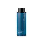 ProtoClinical k-beauty tall blue-gray beauty product silhouette with soft peach side accents on a clean white background.