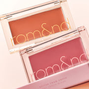 ProtoClinical k-beauty rom&nd Better Than Cheek GLAZED 2.4g (2 Colors) shown as a warm brown compact layered over a coral blush pan on a pale pink background