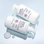 ProtoClinical k-beauty APLB Collagen EGF Peptide Body Lotion 300ml shown as two white pump bottles angled on a glossy pale blue surface with white lotion drops