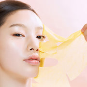 ProtoClinical k-beauty warm peach beauty graphic with soft mauve corners on a light background.