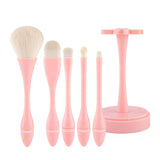 CORINGCO Egg Holder Brush Set 5P by ProtoClinical, a k-beauty makeup brush set with five brushes and a rounded egg-shaped holder shown in a clean studio product layout.