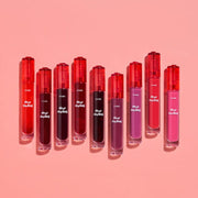 ProtoClinical k-beauty ETUDE Dear Darling Water Gel Tint 5g single red gel tint bottle with a dark cap, centered upright on a pale peach studio background