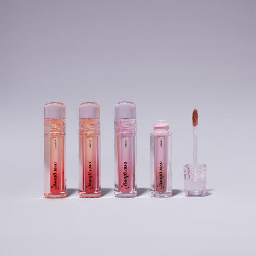 ProtoClinical k-beauty ETUDE Over Glowy Tint 3g #Not Bad single glossy pink lip tint tube with a silver cap, centered upright on a pale peach studio background