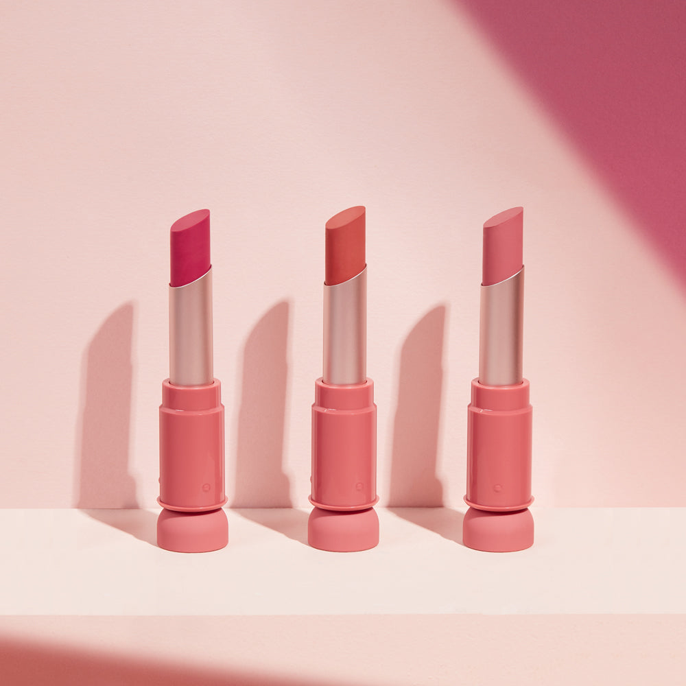 ProtoClinical k-beauty ETUDE Fixing Tint Bar 3.2g slim pink tint bar packaging arranged upright on a pale studio background with soft rose tones