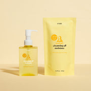 ProtoClinical k-beauty ETUDE Real Art Cleansing Oil Moisture & Refill 185ml+185ml with a clear pump bottle and yellow refill pouch standing side by side on a warm pale yellow background