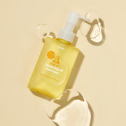 ProtoClinical k-beauty ETUDE Real Art Cleansing Oil Moisture & Refill 185ml+185ml clear pump bottle shown at an angle with translucent oil droplets on a pale yellow background
