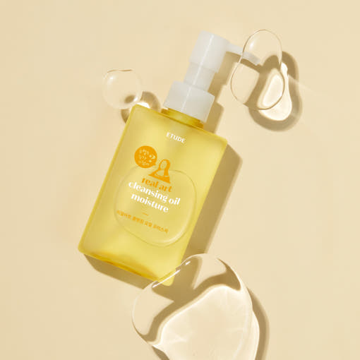 ProtoClinical k-beauty ETUDE Real Art Cleansing Oil Moisture & Refill 185ml+185ml clear pump bottle shown at an angle with translucent oil droplets on a pale yellow background