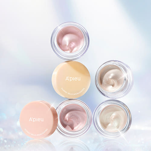 ProtoClinical k-beauty A'pieu Juicy Pang Glossy Jelly Highlighter 3.8g (2 Colors) four open jars and two lids stacked on a cool blue reflective background