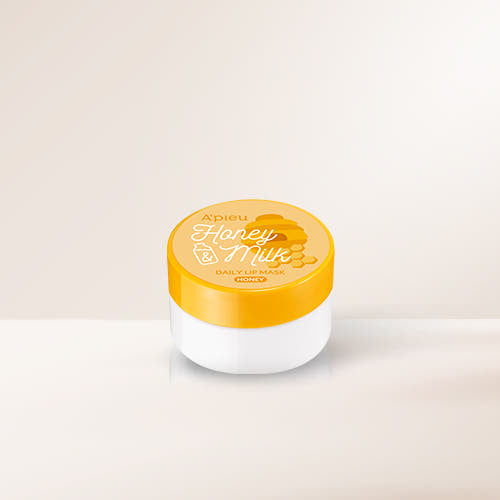 ProtoClinical k-beauty A'pieu Honey & Milk Daily Lip Mask 6g (3 Flavours) shown as a single white lip mask jar with a yellow Honey lid centered on a light beige background