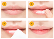 ProtoClinical k-beauty A'pieu Honey & Milk Lip Scrub 8ml white lip scrub tube with a yellow cap on a warm yellow gradient graphic with marketing text