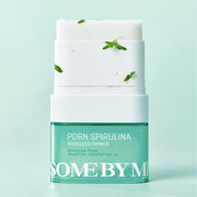 ProtoClinical k-beauty [SOME BY MI] PDRN Spirulina Poreless Primer 10g shown as a single green primer package laid horizontally on a pale aqua background with soft pink side shading
