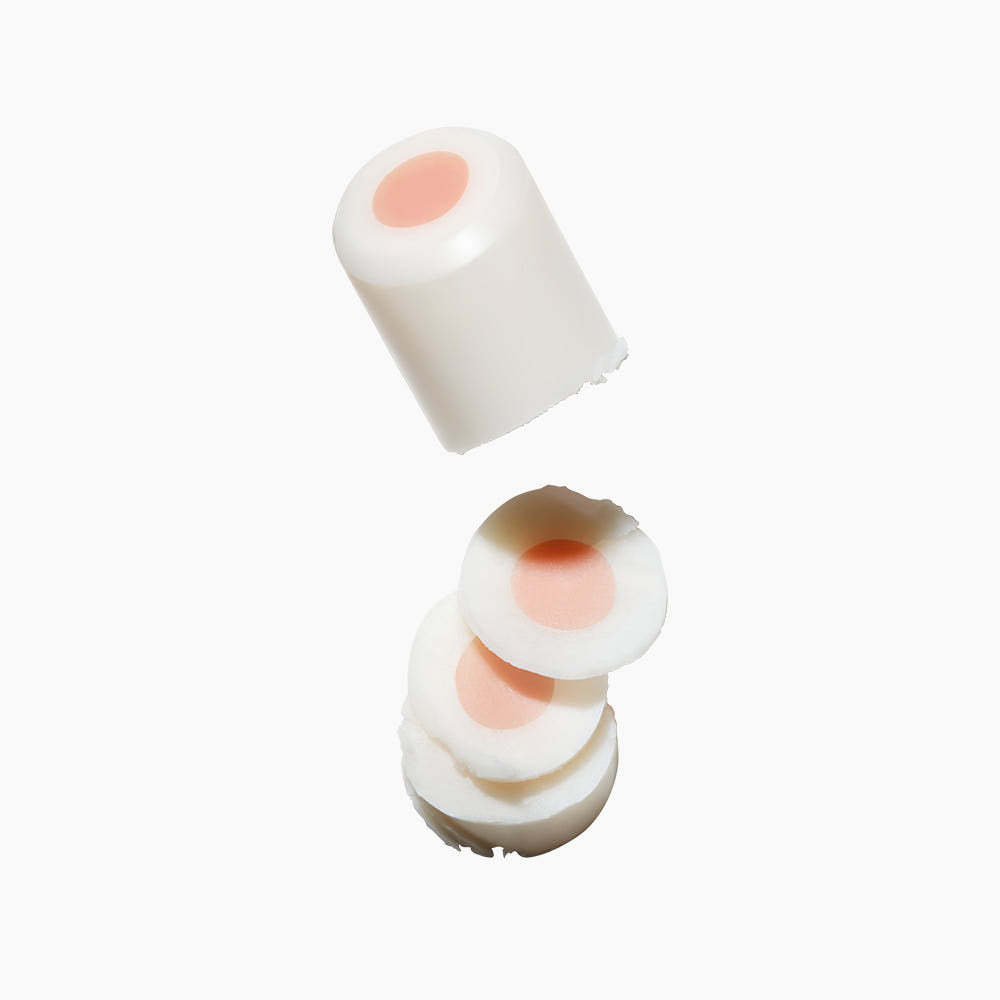 ProtoClinical k-beauty beauty product packaging in soft neutral tones on a light background.