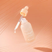 ProtoClinical k-beauty 9wishes PDRN Collagen Ampoule 30ml single upright ampoule bottle centered on a warm peach background