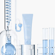 ProtoClinical k-beauty 9wishes Hydra Ampoule Cream Nano Plus+ 50ml three upright blue-gray containers on a pale cream background with soft blue lower accents