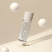ProtoClinical k-beauty 9wishes Vegan Collagen Ampoule Essence 120ml single upright beige bottle centered on a warm beige background with a soft white lower fade