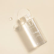 ProtoClinical k-beauty 9wishes Vegan Collagen Ampoule Essence 120ml single upright beige bottle centered on a warm beige background