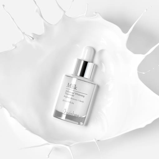 ProtoClinical k-beauty 9wishes Milk Whitening Serum 30ml single upright serum package on a pale beige background with a soft brown base shadow