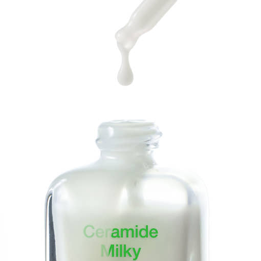 ProtoClinical k-beauty [By Wishtrend] Ceramide Milky Ampoule 30ml close-up frosted ampoule bottle with a milky dropper above the open neck on a white background