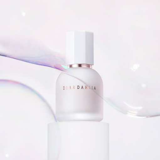 ProtoClinical k-beauty warm beige and rose beauty graphic with a muted peach center on a light background.