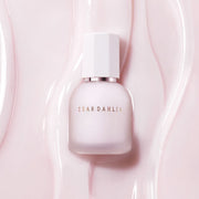 ProtoClinical k-beauty soft taupe beauty product silhouette with a muted mauve center on a pale background.