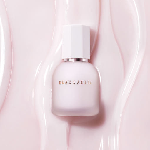 ProtoClinical k-beauty soft taupe beauty product silhouette with a muted mauve center on a pale background.