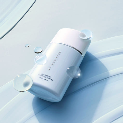 ProtoClinical k-beauty cool blue beauty product silhouette with a pale center on a light background.