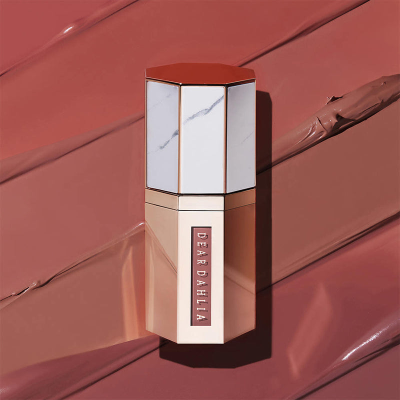 ProtoClinical k-beauty [DEAR DAHLIA] Paradise Dream Velvet Lip Mousse 6.5ml muted red lip mousse silhouette centered on a warm pink background