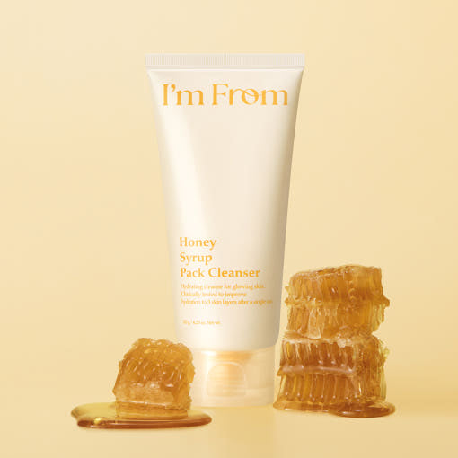 ProtoClinical k-beauty I'm from Honey Syrup Pack Cleanser 120g single upright pale beige cleanser container centered on a warm yellow background with darker honey-toned lower shading.