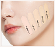 ProtoClinical k-beauty cosmetic packaging in warm peach and brown tones on a light background.