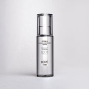 ProtoClinical k-beauty IOPE: Xmd Stem Iii Clinical Recovery Serum (30ml) dark gray cosmetic bottle on a pale lavender and white background