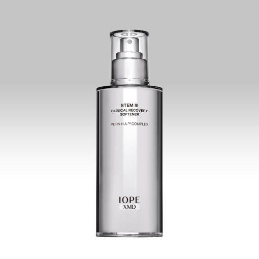 ProtoClinical k-beauty IOPE XMD STEM III Clinical Recovery Softener 130ml slim gray cosmetic bottle on a pale lavender and white background