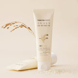 ProtoClinical k-beauty [THANK YOU FARMER] Rice Pure Barrier Capsule Cream 80ml with one upright cream tube, a second tube laid behind it, and rice grain accents on a warm beige background