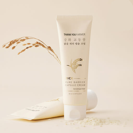 ProtoClinical k-beauty [THANK YOU FARMER] Rice Pure Barrier Capsule Cream 80ml with one upright cream tube, a second tube laid behind it, and rice grain accents on a warm beige background