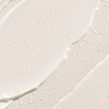 ProtoClinical k-beauty [THANK YOU FARMER] Rice Pure Barrier Capsule Cream 80ml close-up cream swatch with scattered white capsule beads and smooth pale beige texture