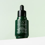 ProtoClinical k-beauty [NATURE REPUBLIC] Expert Drop Intense Barrier Ampoule 25ml dark green bottle silhouette on a pale mint background.